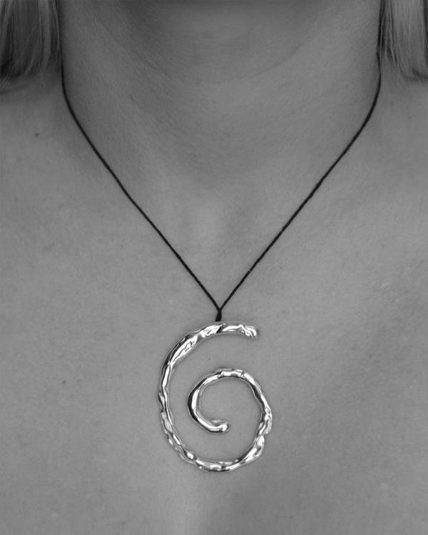 Silver spiral pendant on a black cord
